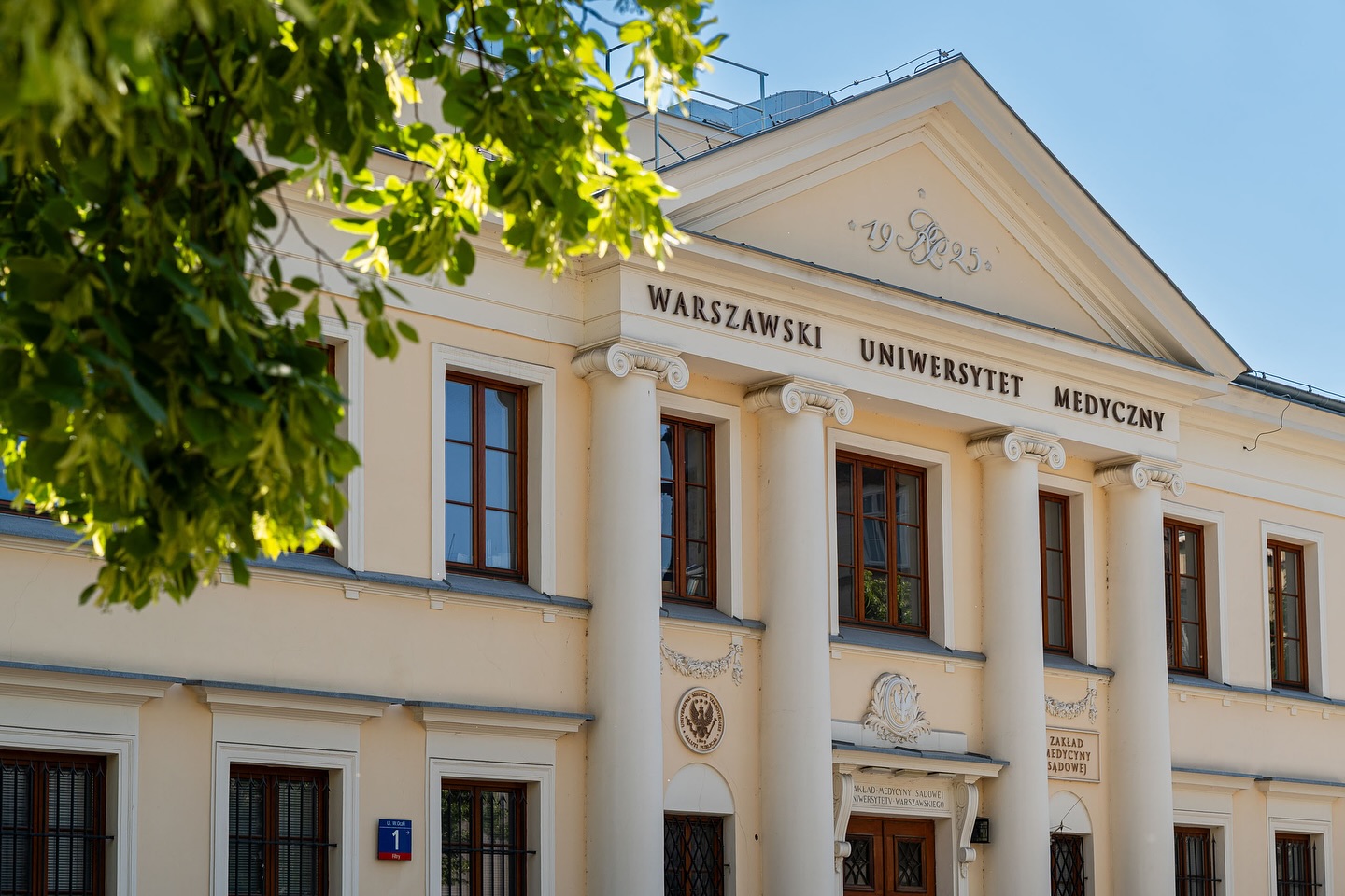 Front of the Medical University of Warsaw building with its name above the columns